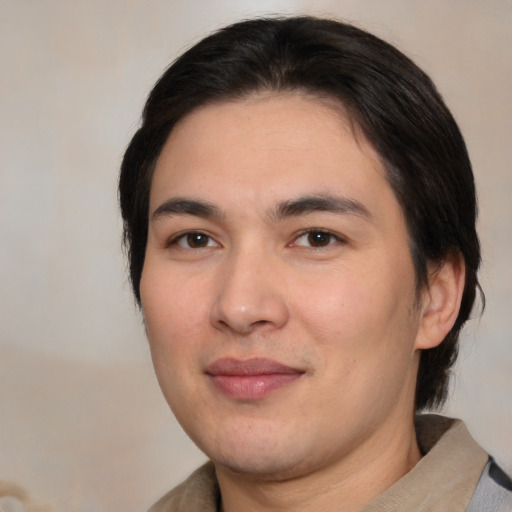 Joyful white young-adult male with medium  brown hair and brown eyes