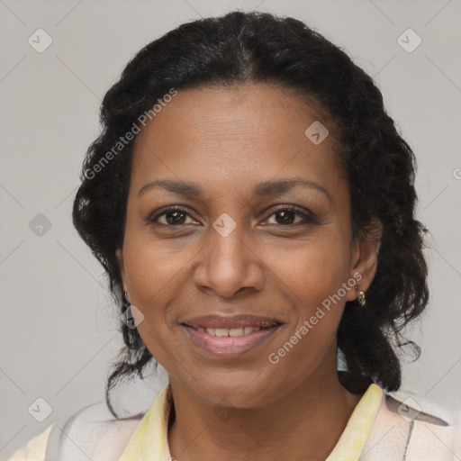 Joyful black adult female with medium  brown hair and brown eyes