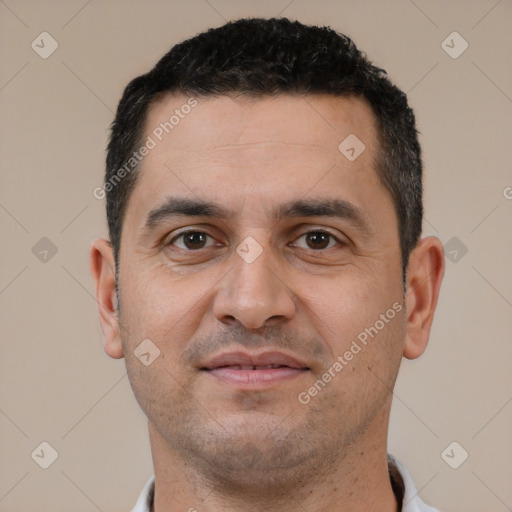 Joyful white young-adult male with short  black hair and brown eyes