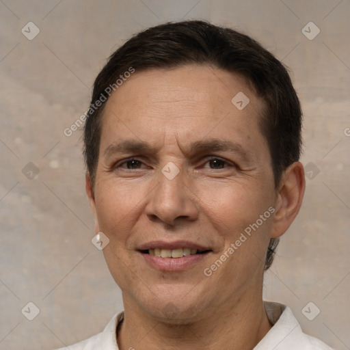 Joyful white adult male with short  brown hair and brown eyes