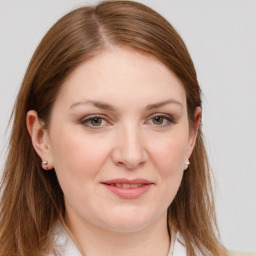 Joyful white young-adult female with long  brown hair and grey eyes