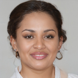 Joyful white young-adult female with medium  brown hair and brown eyes