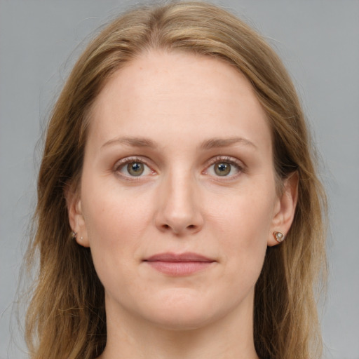 Joyful white young-adult female with long  brown hair and grey eyes