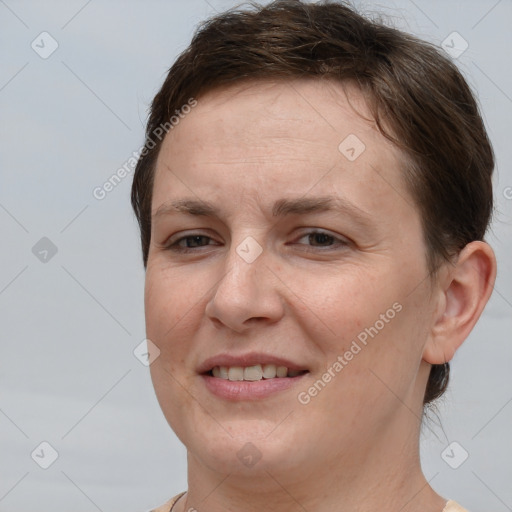 Joyful white adult female with short  brown hair and brown eyes