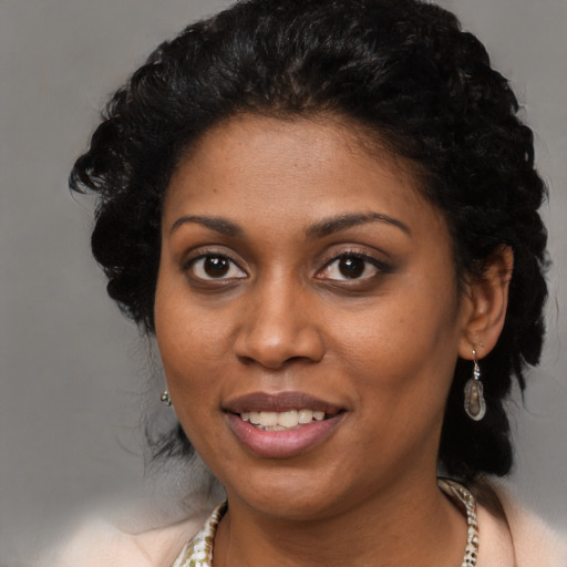 Joyful black young-adult female with medium  black hair and brown eyes