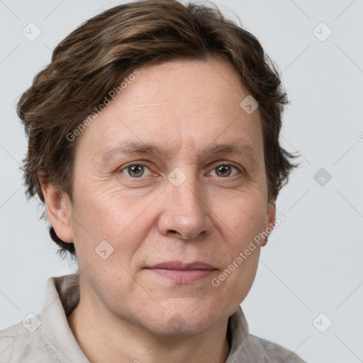 Joyful white adult female with short  brown hair and grey eyes