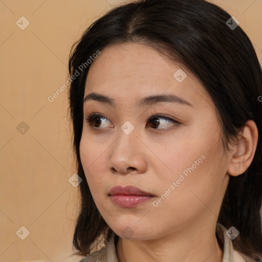 Neutral white young-adult female with long  brown hair and brown eyes