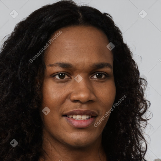 Joyful black young-adult female with long  brown hair and brown eyes