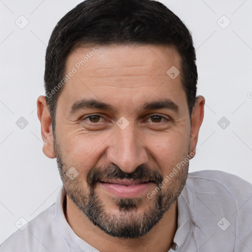 Joyful white adult male with short  brown hair and brown eyes