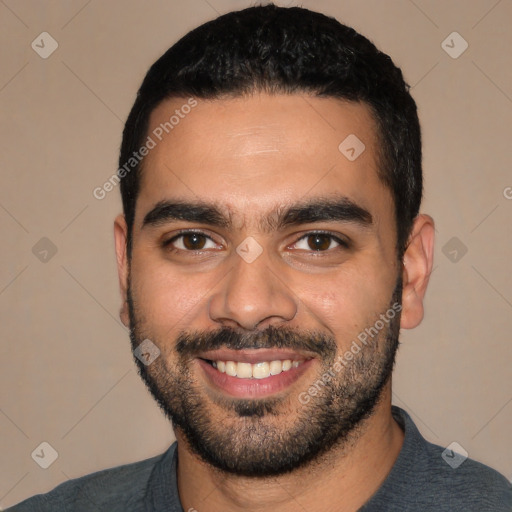 Joyful latino young-adult male with short  black hair and brown eyes