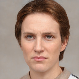 Joyful white adult female with medium  brown hair and grey eyes