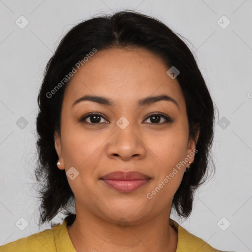 Joyful latino young-adult female with medium  brown hair and brown eyes