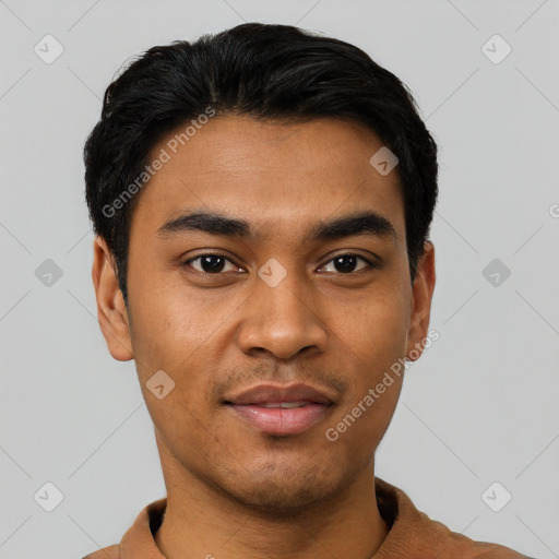 Joyful latino young-adult male with short  black hair and brown eyes