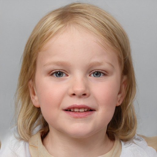 Joyful white child female with medium  brown hair and blue eyes