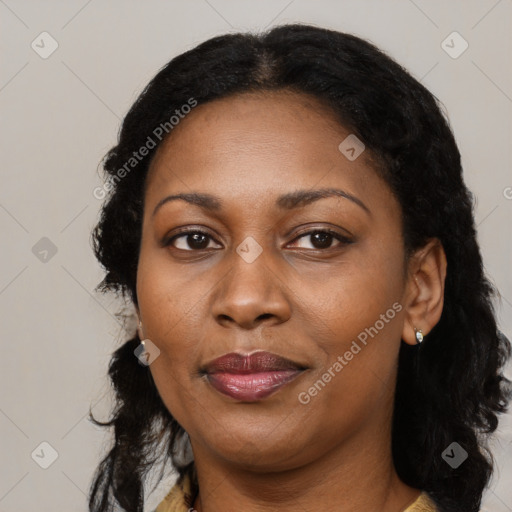 Joyful black adult female with medium  black hair and brown eyes