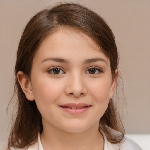 Joyful white child female with medium  brown hair and brown eyes