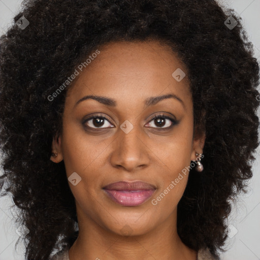 Joyful black young-adult female with long  brown hair and brown eyes