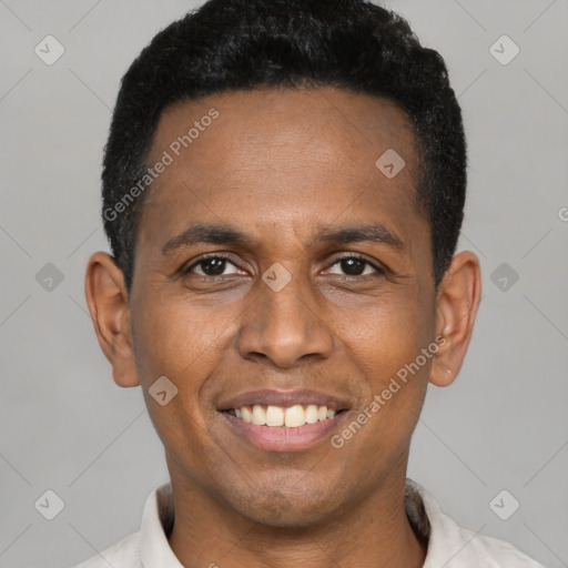 Joyful black young-adult male with short  black hair and brown eyes