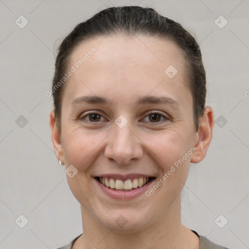 Joyful white young-adult female with short  brown hair and brown eyes