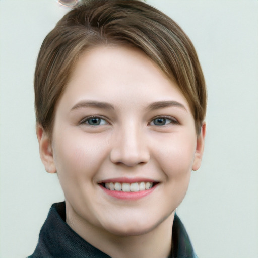 Joyful white young-adult female with short  brown hair and grey eyes