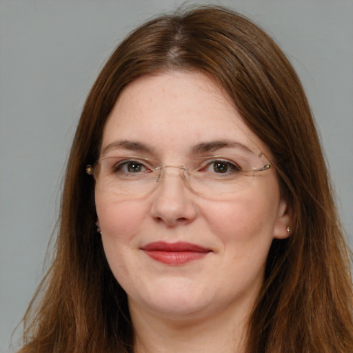 Joyful white adult female with long  brown hair and brown eyes