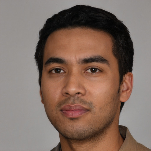 Neutral latino young-adult male with short  black hair and brown eyes