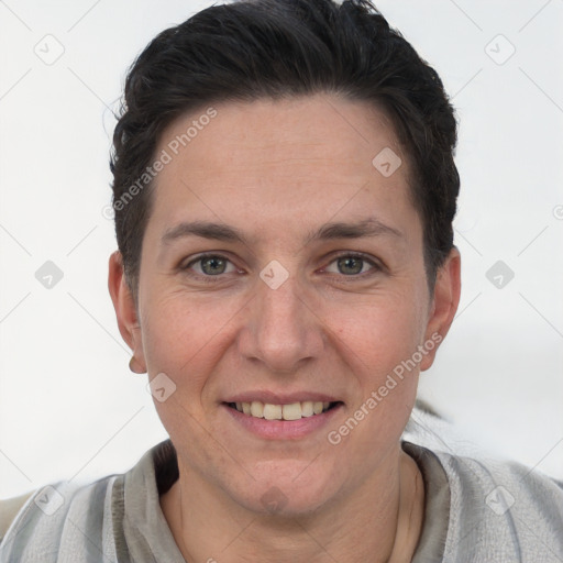 Joyful white adult female with short  brown hair and brown eyes