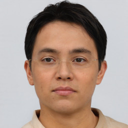 Neutral asian young-adult male with short  brown hair and brown eyes