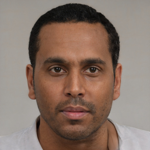 Neutral black young-adult male with short  black hair and brown eyes