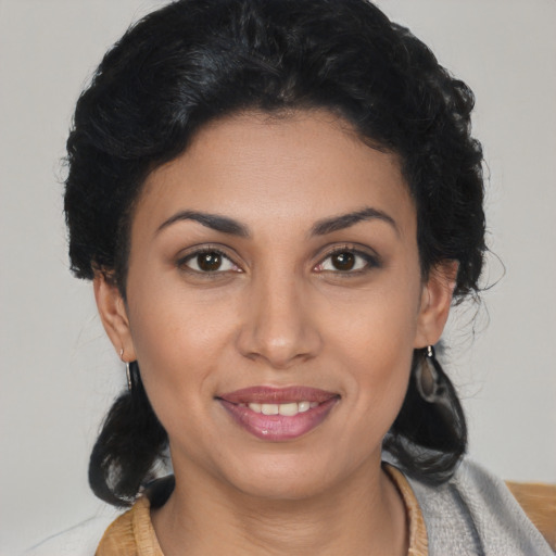 Joyful latino young-adult female with medium  black hair and brown eyes