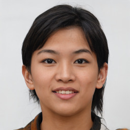 Joyful asian young-adult female with medium  black hair and brown eyes