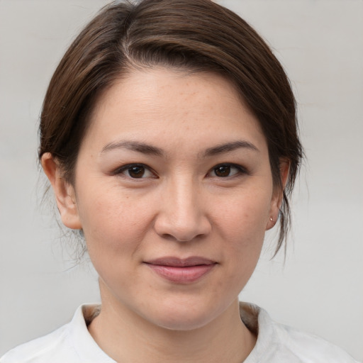 Joyful white young-adult female with medium  brown hair and brown eyes