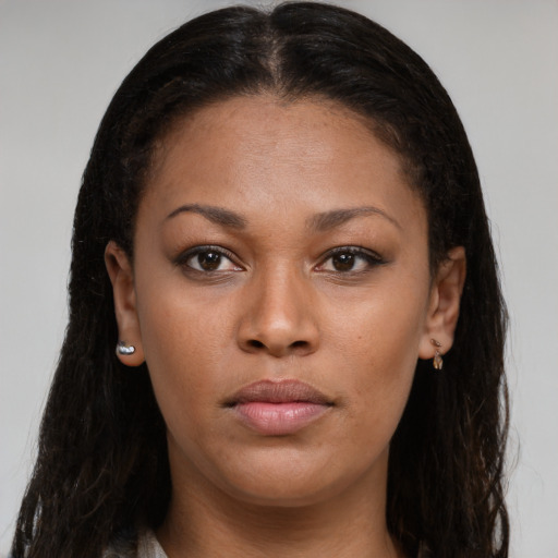 Neutral black young-adult female with long  brown hair and brown eyes