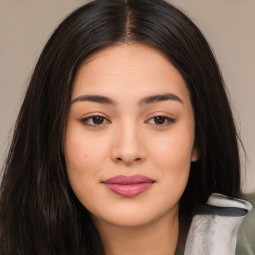 Joyful asian young-adult female with long  brown hair and brown eyes