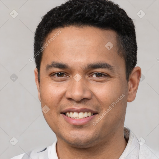 Joyful white young-adult male with short  black hair and brown eyes