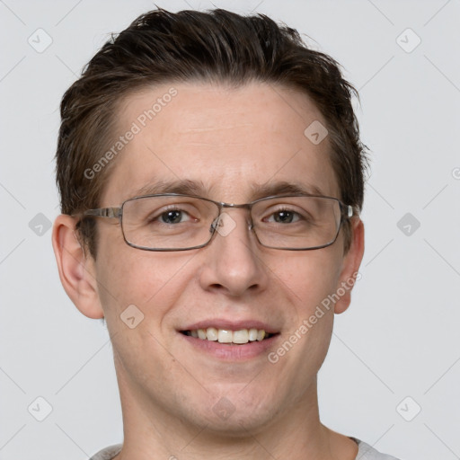 Joyful white adult male with short  brown hair and grey eyes