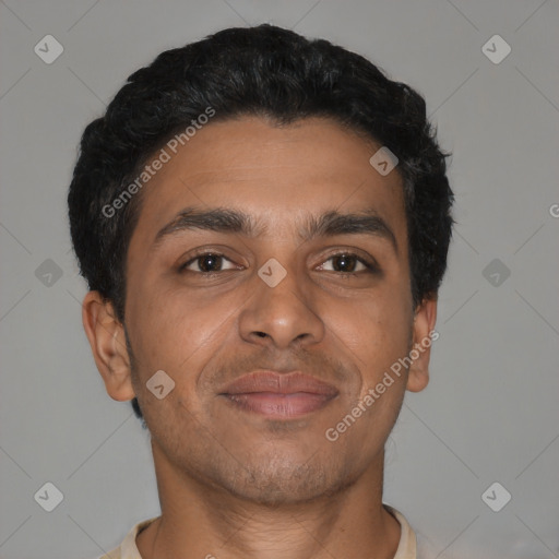 Joyful latino young-adult male with short  brown hair and brown eyes