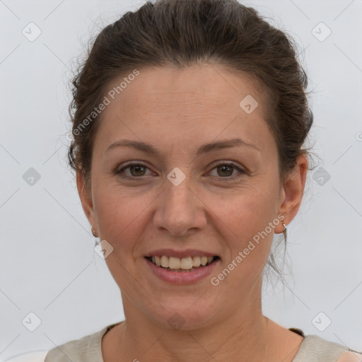 Joyful white adult female with short  brown hair and brown eyes