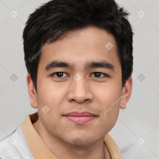 Joyful asian young-adult male with short  brown hair and brown eyes