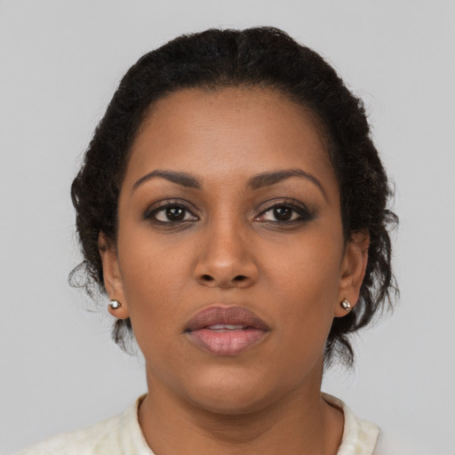 Neutral black young-adult female with short  brown hair and brown eyes
