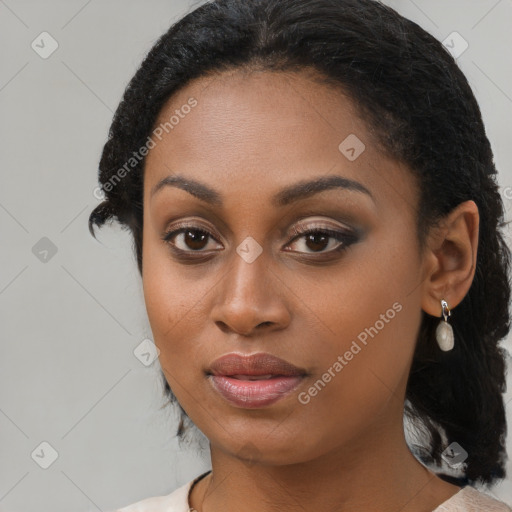 Joyful black young-adult female with medium  brown hair and brown eyes