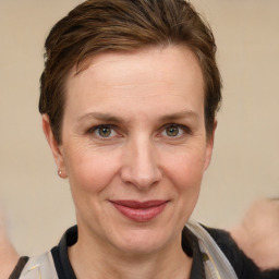 Joyful white adult female with short  brown hair and grey eyes