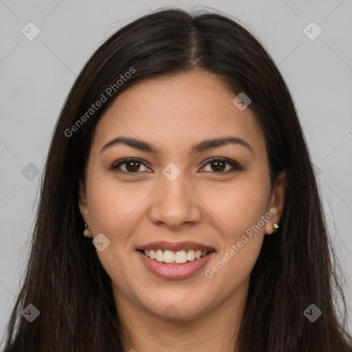 Joyful latino young-adult female with long  brown hair and brown eyes