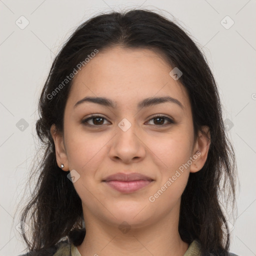 Joyful latino young-adult female with long  brown hair and brown eyes