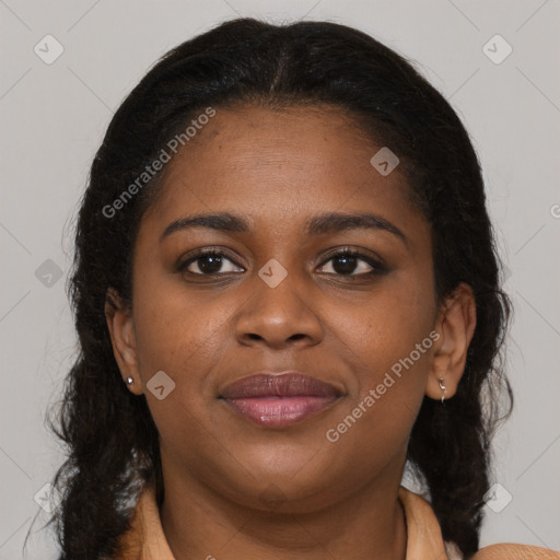 Joyful black young-adult female with medium  brown hair and brown eyes