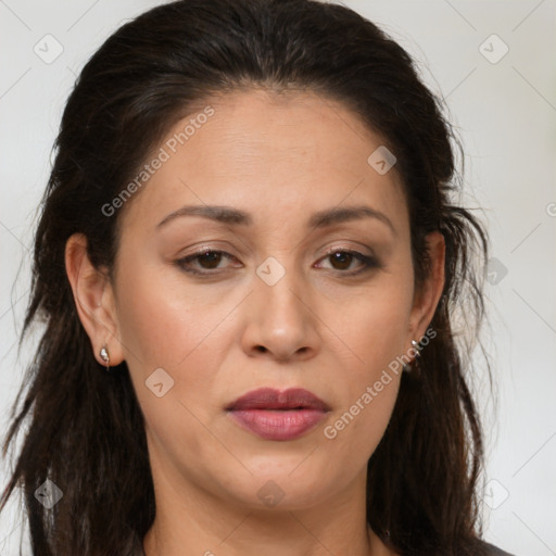 Joyful white adult female with long  brown hair and brown eyes