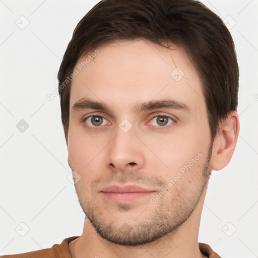 Neutral white young-adult male with short  brown hair and brown eyes