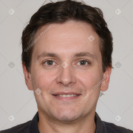 Joyful white adult male with short  brown hair and grey eyes