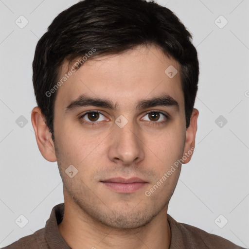 Neutral white young-adult male with short  brown hair and brown eyes