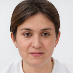 Joyful white young-adult female with short  brown hair and brown eyes